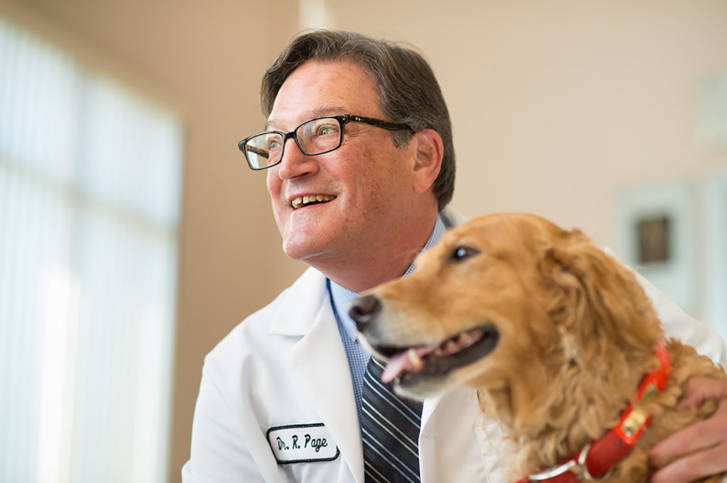 Dr. Rodney Page with golden retriever